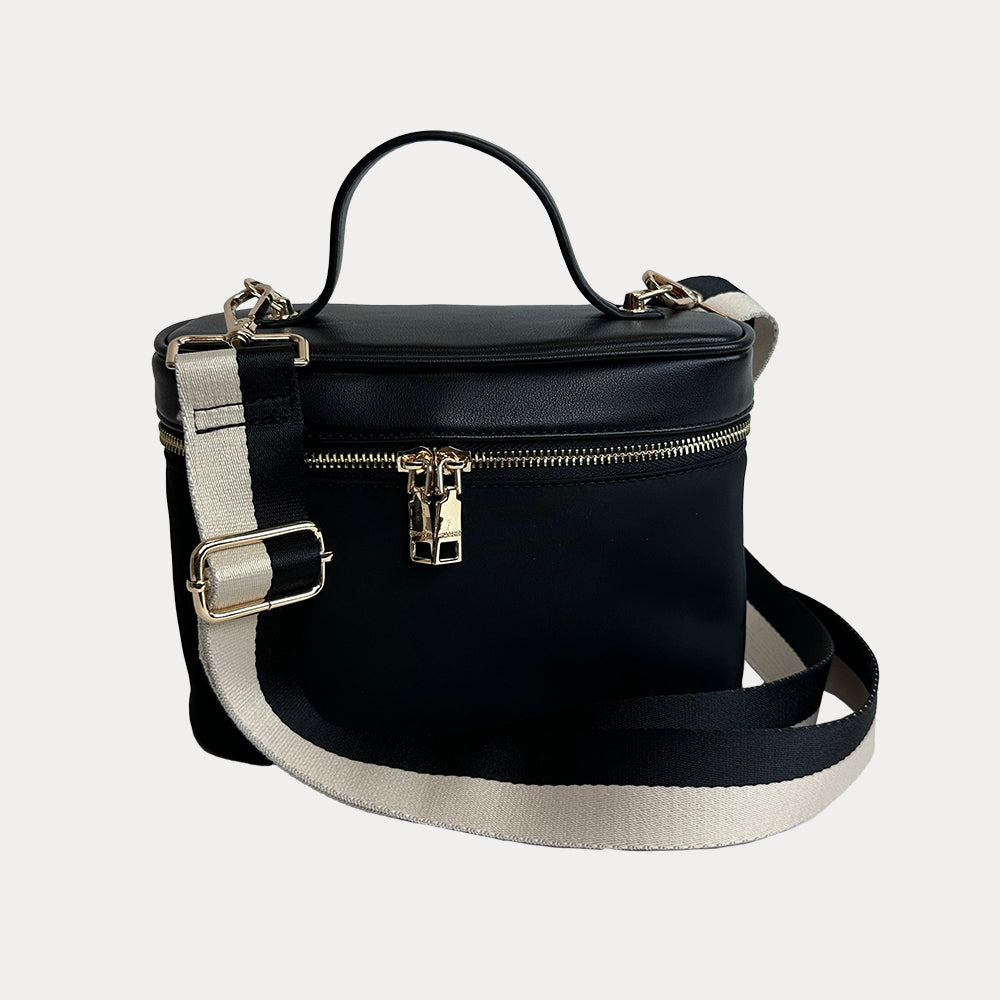 Jenna Crossbody Bag with a Top Handle in Black. Vegan Leather Details with a Cream & Black Striped Bag Strap