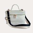 Jenna Crossbody Bag with a Top Handle in Cream. Vegan Leather Details with a Cream & Black Striped Bag Strap