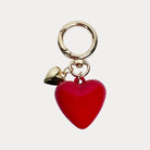 Keychain Heart Charm.  Gold Jump Ring to clip to bag.  Features a Large Red Heart and Smaller Gold Heart.