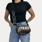 Woman wearing the Ramona Bag as a crossbody bag in Bronze