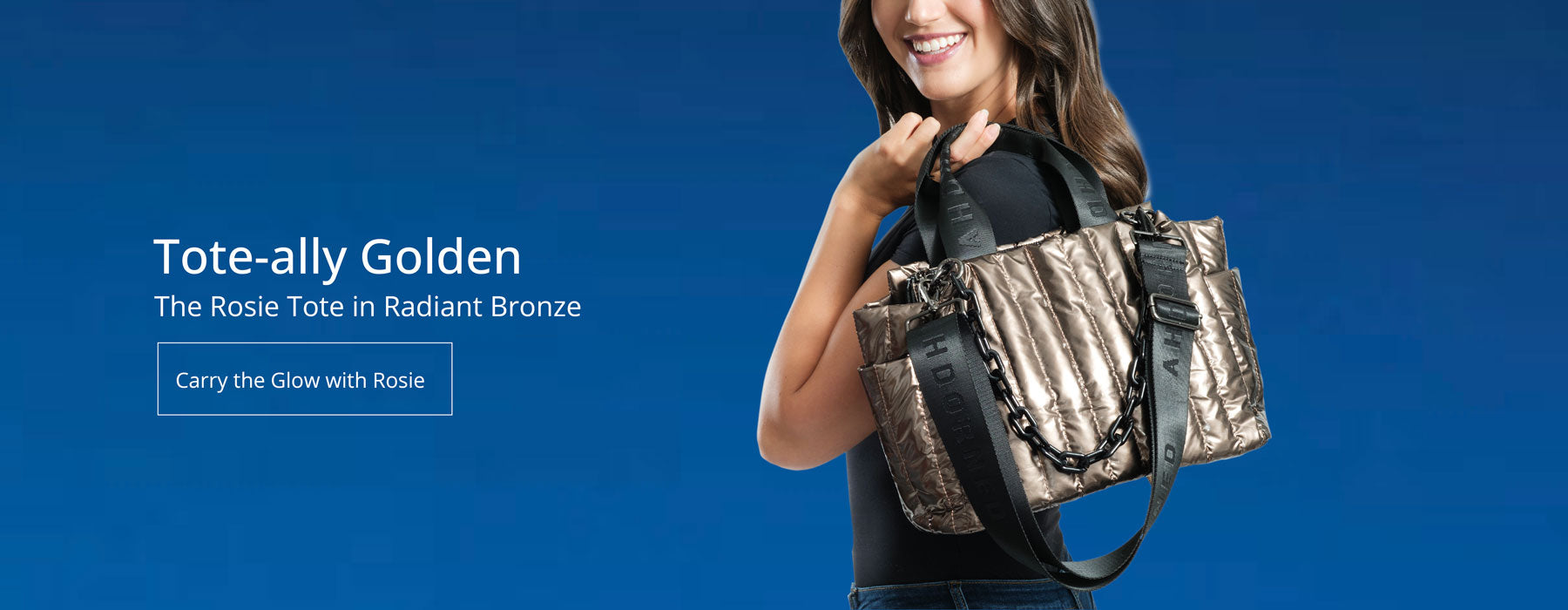 Blue Background.  Woman holding the Rosie Quilted Tote in Bronze over her shoulder.  Text Says: Tote-ally Golden, the Rosie Tote in Radiant Bronze.  Button: Carry the Glow with Rosie