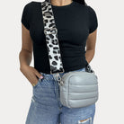 women wearing the Sadie Quilted Vegan Leather Crossbody in Grey with a Grey Leopard Bag Strap