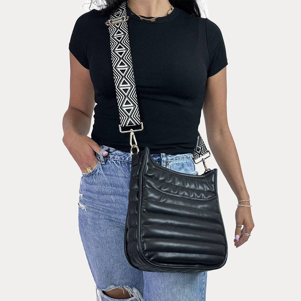 women wearing the Sarah Quilted Vegan Leather Messenger in Black with a Geometric Patterned Bag Strap