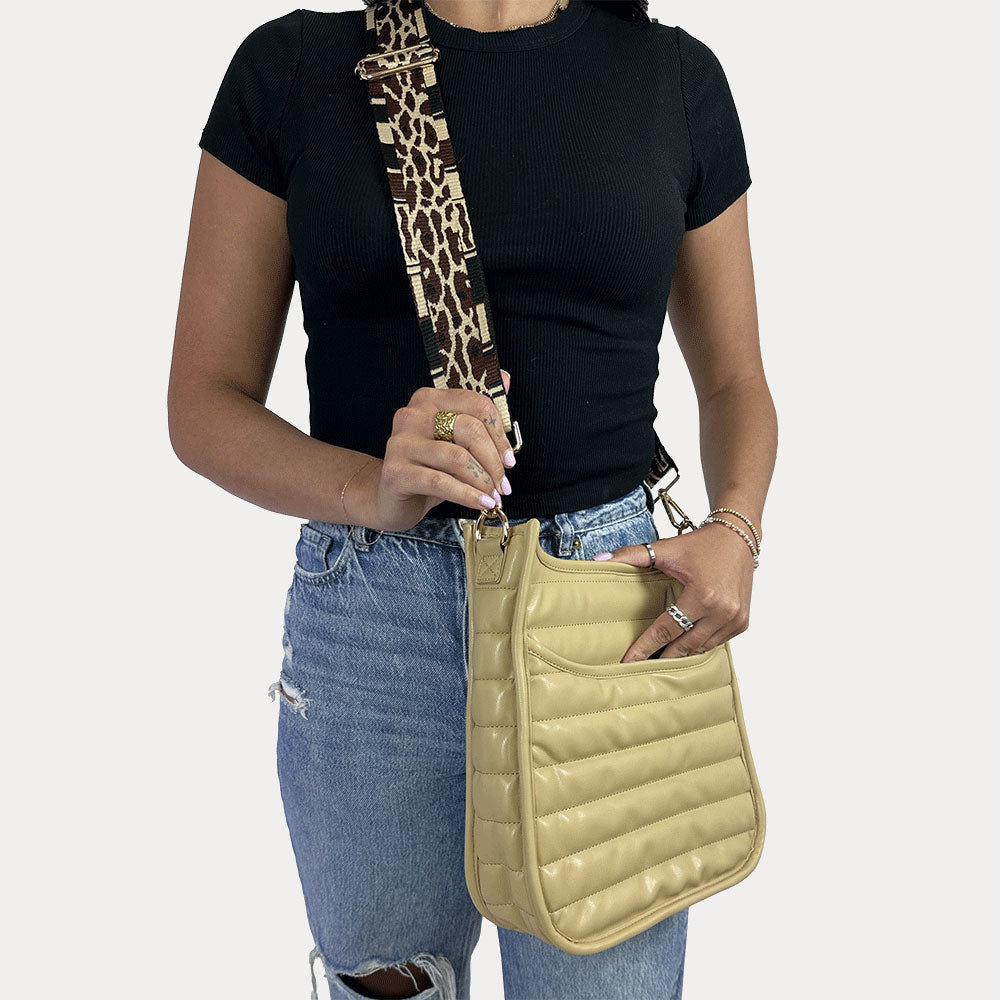 women wearing the Sarah Quilted Vegan Leather Messenger in Dune with a Neutral Animal Print Bag Strap